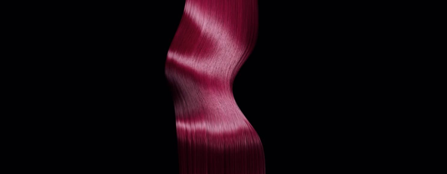Imagen de cabello largo teñido de rosa vibrante, que ilustra consejos de expertos sobre cómo cuidar el cabello teñido y mantener su salud y vitalidad.