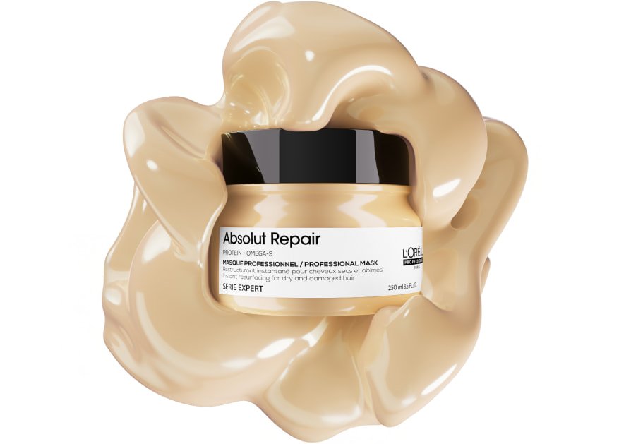 Imagen del producto: mascarilla capilar L’Oréal Professionnel Absolut Repair sobre un fondo texturizado, que resalta su textura rica y untuosa para cabello dañado.